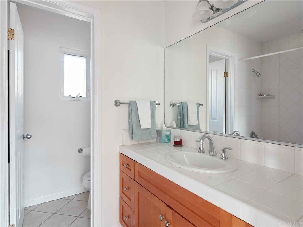 210 Whiting Street, Unit C El Segundo, CA 90245 - Photo 21 of 27 a bathroom with a sink and a mirror