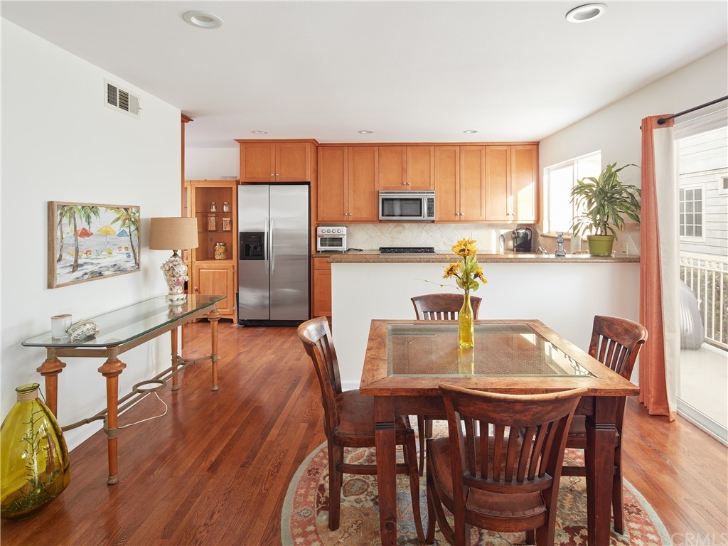 210 Whiting Street, Unit C El Segundo, CA 90245 - Photo 5 of 27 a dining room with furniture and wooden floor