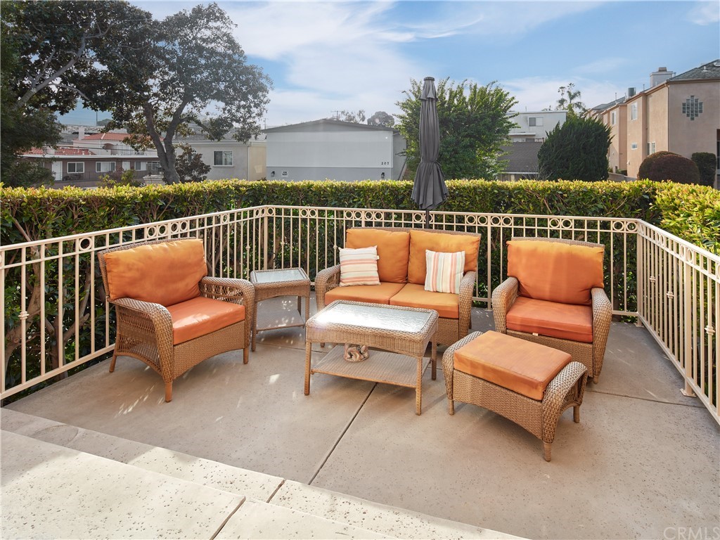 210 Whiting Street, Unit C El Segundo, CA 90245 - Photo 9 of 27 a roof deck with couches and city view