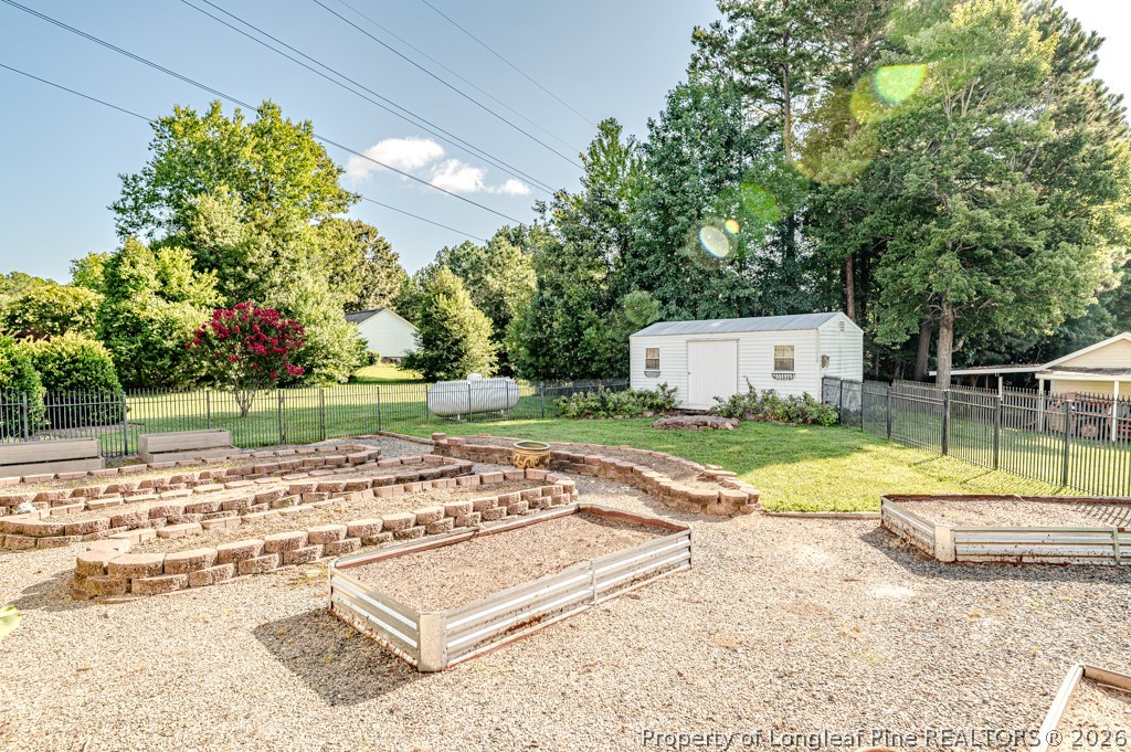 2847 Pickard Road Sanford, NC 27330 - Photo 43 of 50 Fenced back yard with raised beds