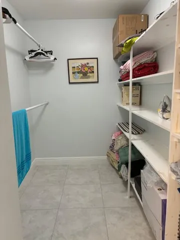 a view of room with racks on the wall