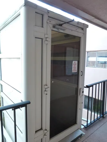 a view of a balcony with wooden floor