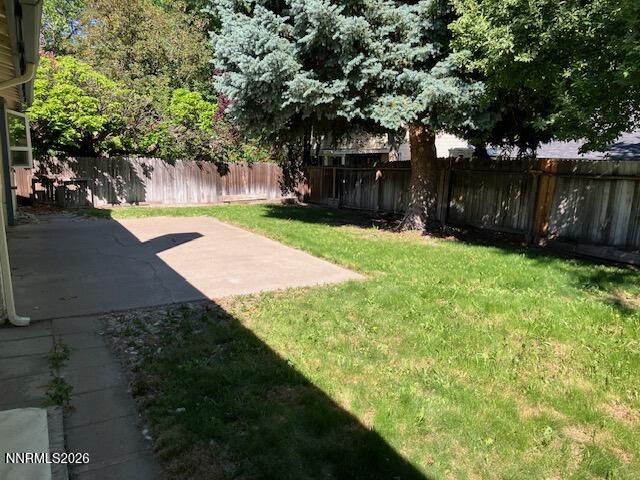 840 Meadow Springs Drive Reno, NV 89509 - Photo 17 of 23 a view of a yard with an tree and wooden fence