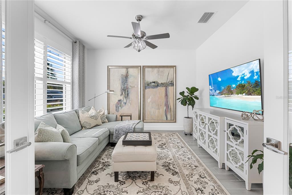 42363 Edgewater Drive Punta Gorda, FL 33982 - Photo 16 of 72 a living room with furniture a flat screen tv and a window