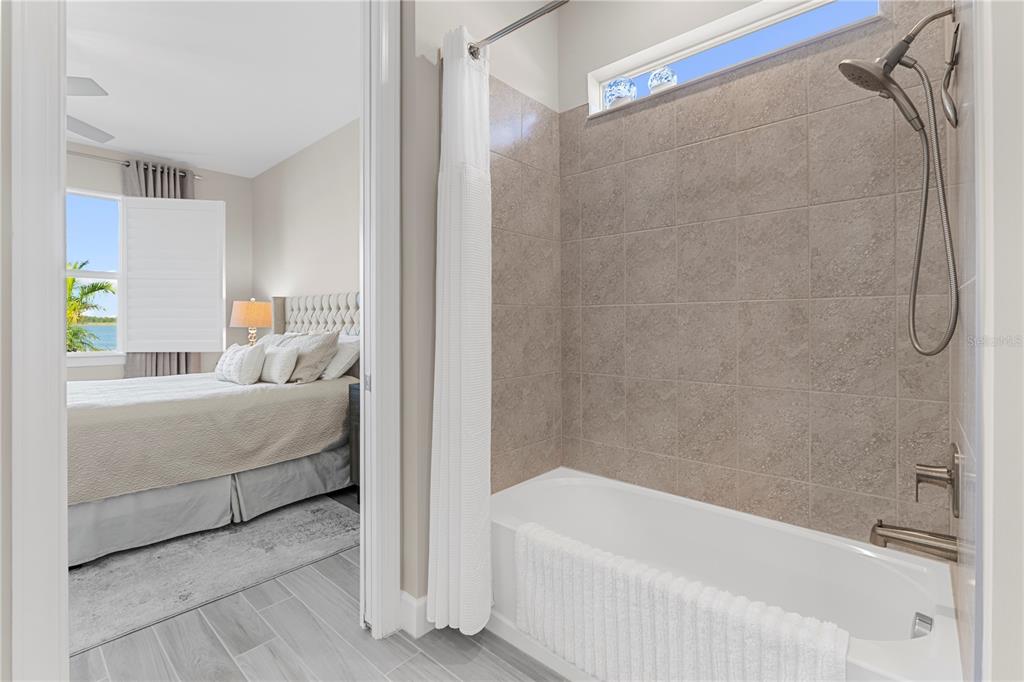 42363 Edgewater Drive Punta Gorda, FL 33982 - Photo 24 of 72 a bathroom with a bathtub and a shower