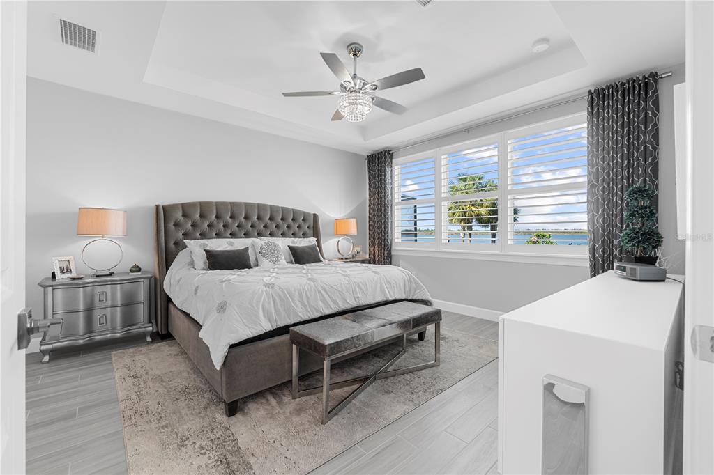 42363 Edgewater Drive Punta Gorda, FL 33982 - Photo 25 of 72 a bedroom with a bed and a table