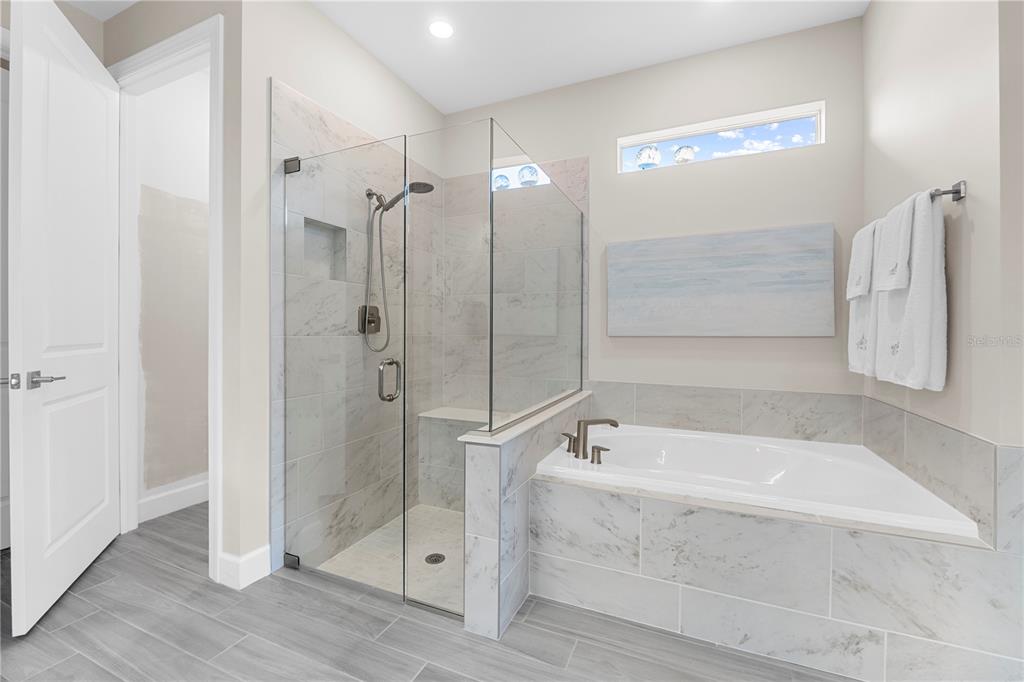 42363 Edgewater Drive Punta Gorda, FL 33982 - Photo 28 of 72 a bathroom with a bathtub and a shower