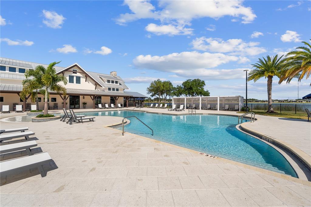42363 Edgewater Drive Punta Gorda, FL 33982 - Photo 68 of 72 a view of a swimming pool with lounge chairs