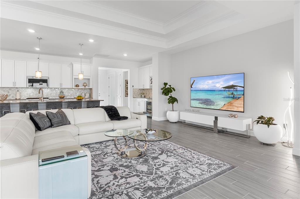 42363 Edgewater Drive Punta Gorda, FL 33982 - Photo 7 of 72 a living room with furniture and a flat screen tv