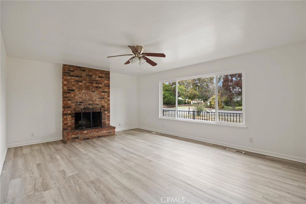 4229 Caballo Way Chico, CA 95973 - Photo 2 of 42 a view of an empty room with glass door and wooden floor