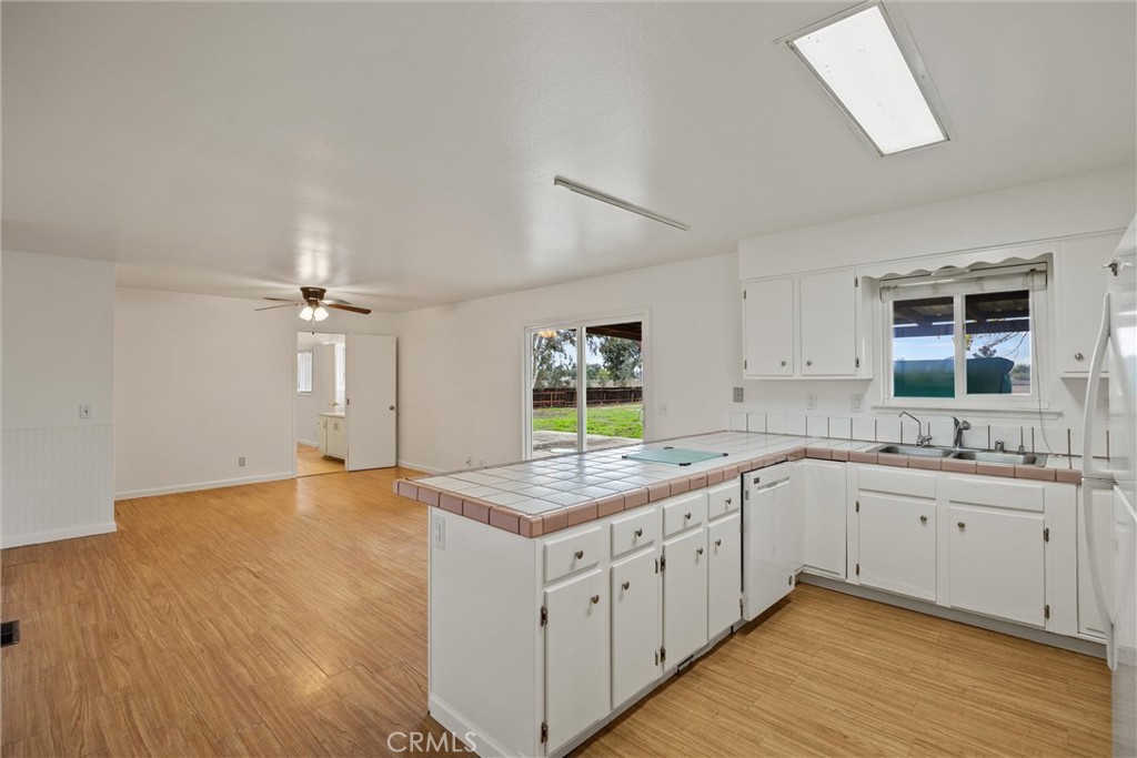 4229 Caballo Way Chico, CA 95973 - Photo 3 of 42 a kitchen with a sink stove and cabinets