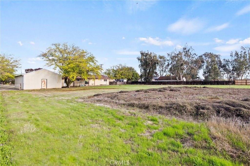 4229 Caballo Way Chico, CA 95973 - Photo 42 of 42 a backyard of a house with lots of green space and trees