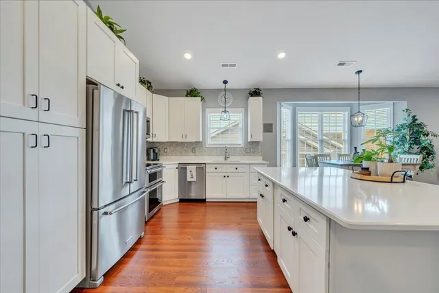 a living room with fireplace furniture and a fireplace