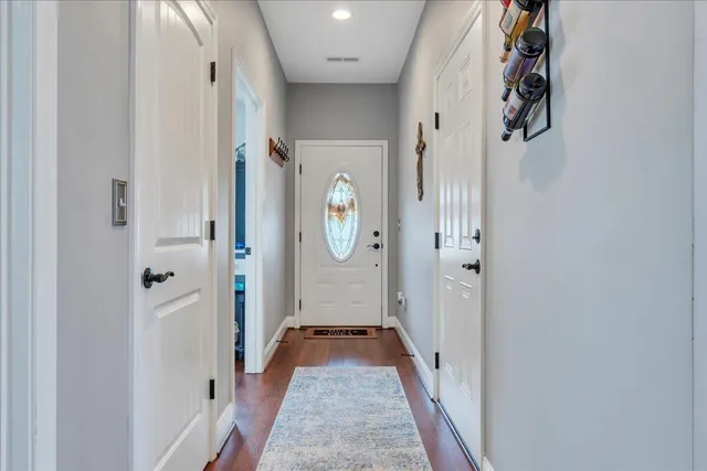 a spacious bathroom with double sink and a mirror
