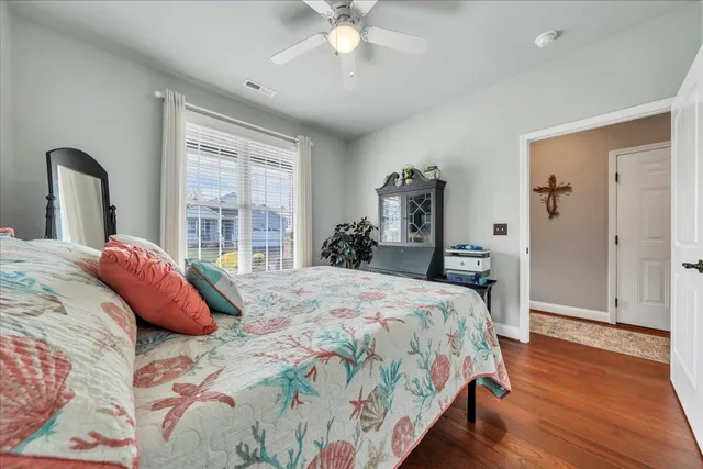 a white toilet sitting next to a white wall
