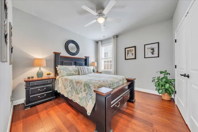 a view of a bathroom with tub mirror and windows