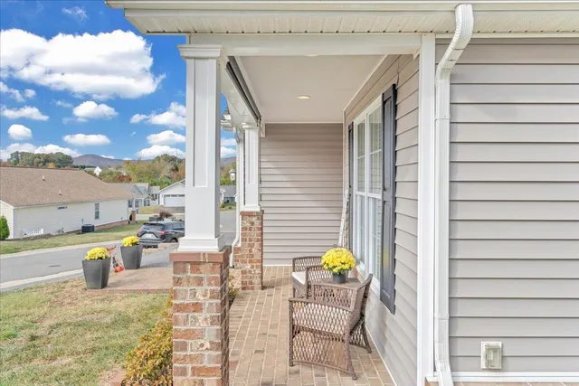a living room with furniture a rug and a window