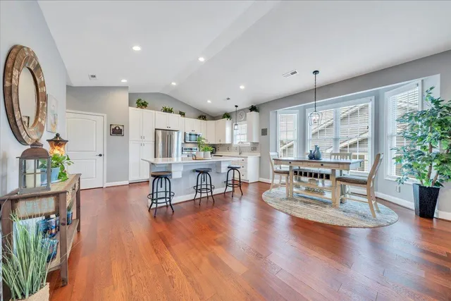 a view of a dining room with furniture window and wooden floor