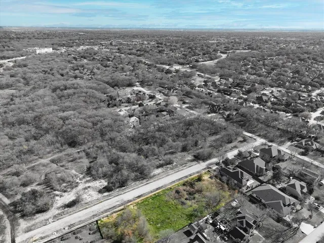 an aerial view of house with yard