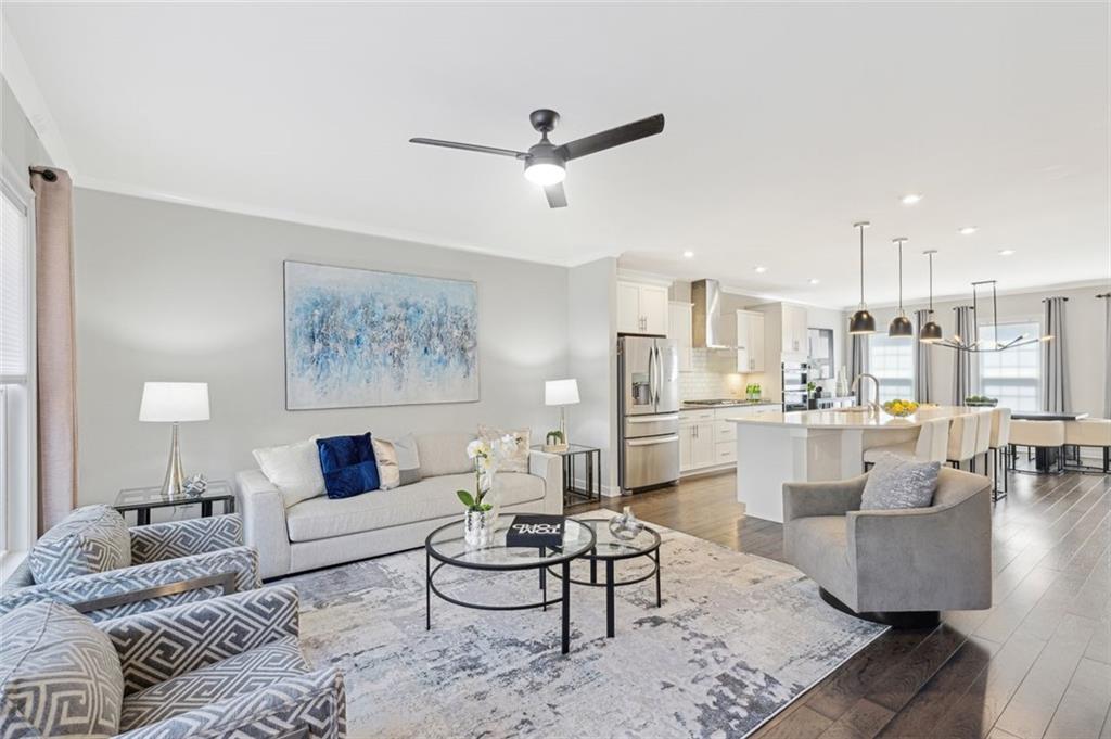 1154 Millennium Park Road Decatur, GA 30033 - Photo 1 of 1 a living room with furniture and a view of kitchen