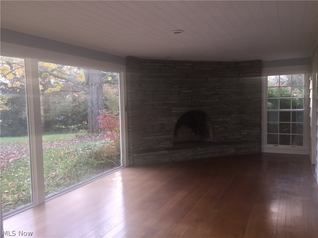 7537 Huntington Road Hudson, OH 44236 - Photo 6 of 10 The sunroom makes for a delightful spot to rest or gather in peaceful ambiance.