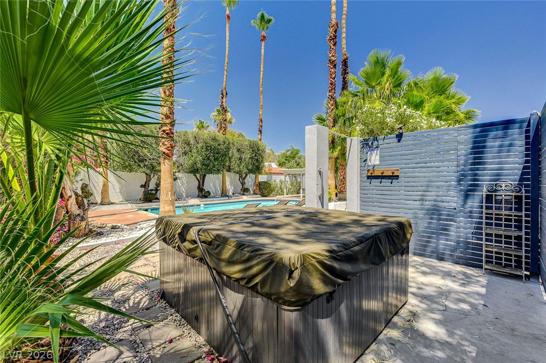4153 Woodcrest Road Las Vegas, NV 89121 - Photo 49 of 58 An inviting backyard oasis offers a serene pool, complementing a private spa for ultimate relaxation.