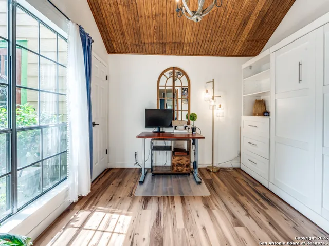 a view of a livingroom with furniture and wooden floor