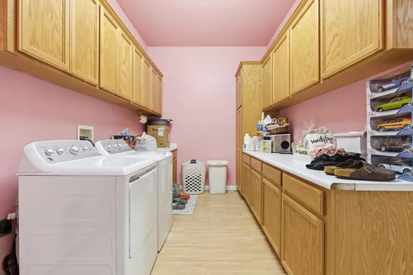 a kitchen with a sink a stove and cabinets