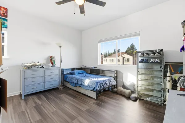 a bedroom with a bed and a window