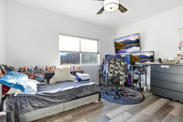 a living room with furniture and a floor to ceiling window