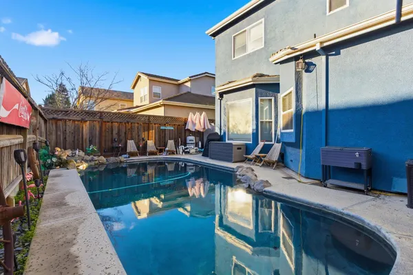 a view of a swimming pool with a patio