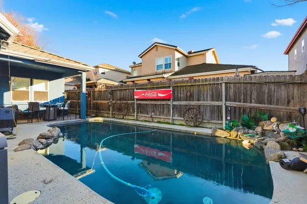 a view of a chairs and table in the patio