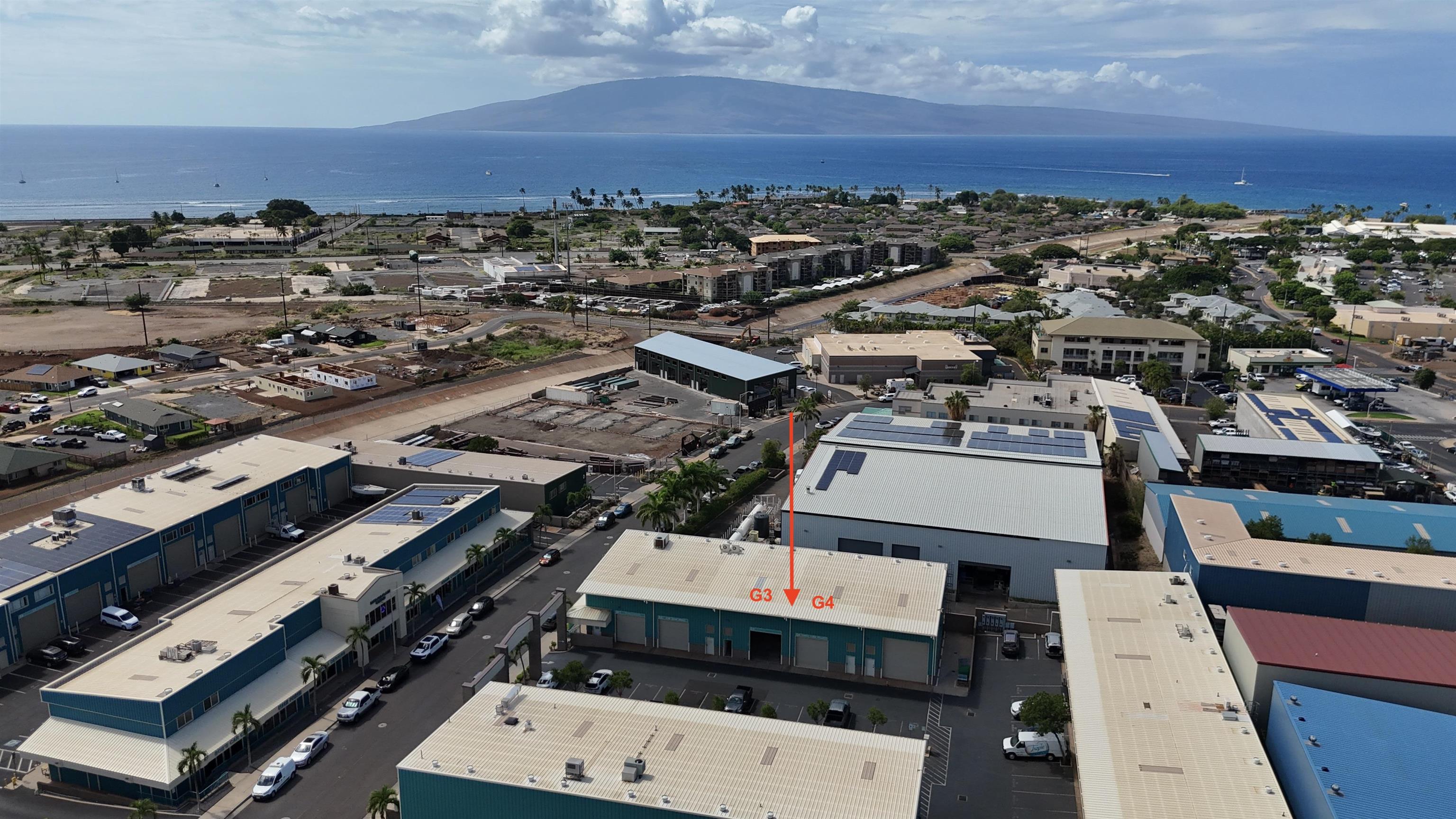 147 Kupuohi Street, Unit G3 Lahaina, HI 96761 - Photo 4 of 12 an aerial view of a residential apartment building with a city view