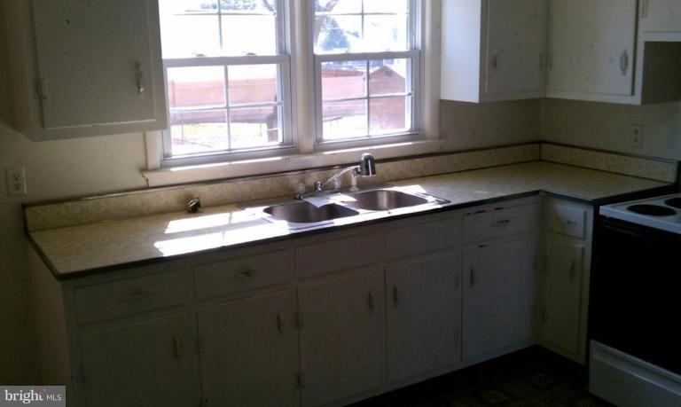 102 East Fourteenth Avenue Ranson, WV 25438 - Photo 3 of 9 a bathroom with a sink and a mirror