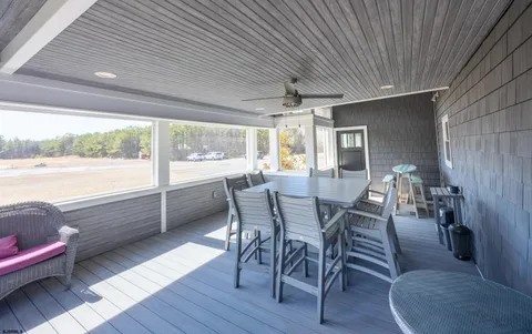 a view of a chairs and table in a patio