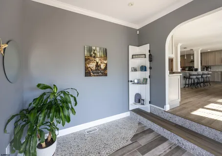 a large kitchen with stainless steel appliances granite countertop a lot of counter space and wooden floors
