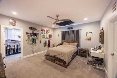 a room with gym equipment and a flat screen tv