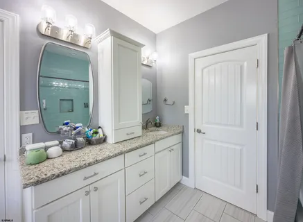 a view of a big house with a big yard and large trees