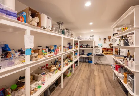 a dining room with furniture a rug and wooden floor