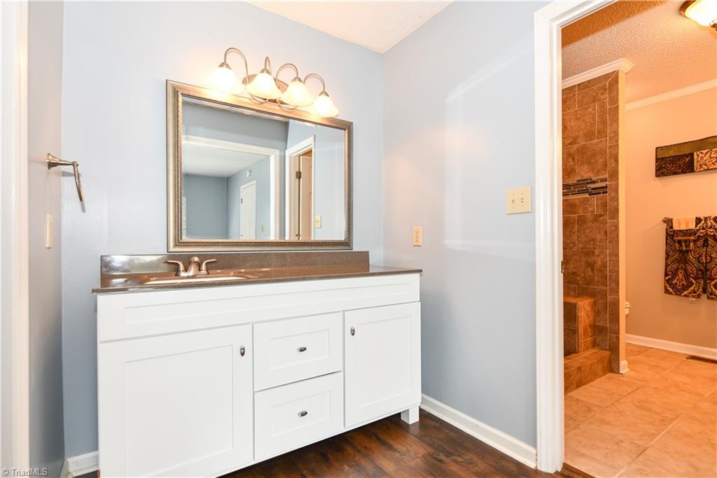 4215 Finch Farm Road Trinity, NC 27370 - Photo 16 of 30 Shaker style vanity & dressing area in master bedroom.