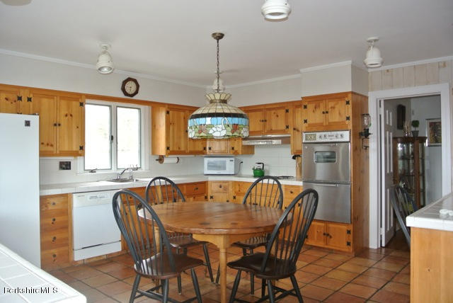 25 Prospect Hill Road Stockbridge, MA 01262 - Photo 11 of 30 a dining room with furniture a chandelier and window