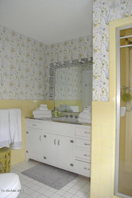 25 Prospect Hill Road Stockbridge, MA 01262 - Photo 15 of 30 a bathroom with a granite countertop sink a toilet and shower