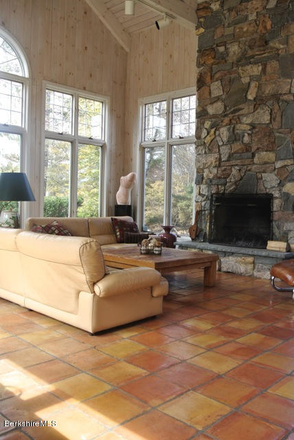 25 Prospect Hill Road Stockbridge, MA 01262 - Photo 22 of 30 a living room with fireplace furniture and a large window