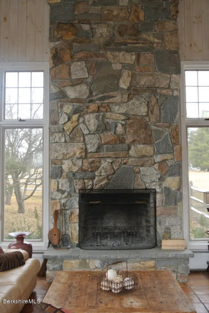 25 Prospect Hill Road Stockbridge, MA 01262 - Photo 23 of 30 a living room with furniture and a fireplace
