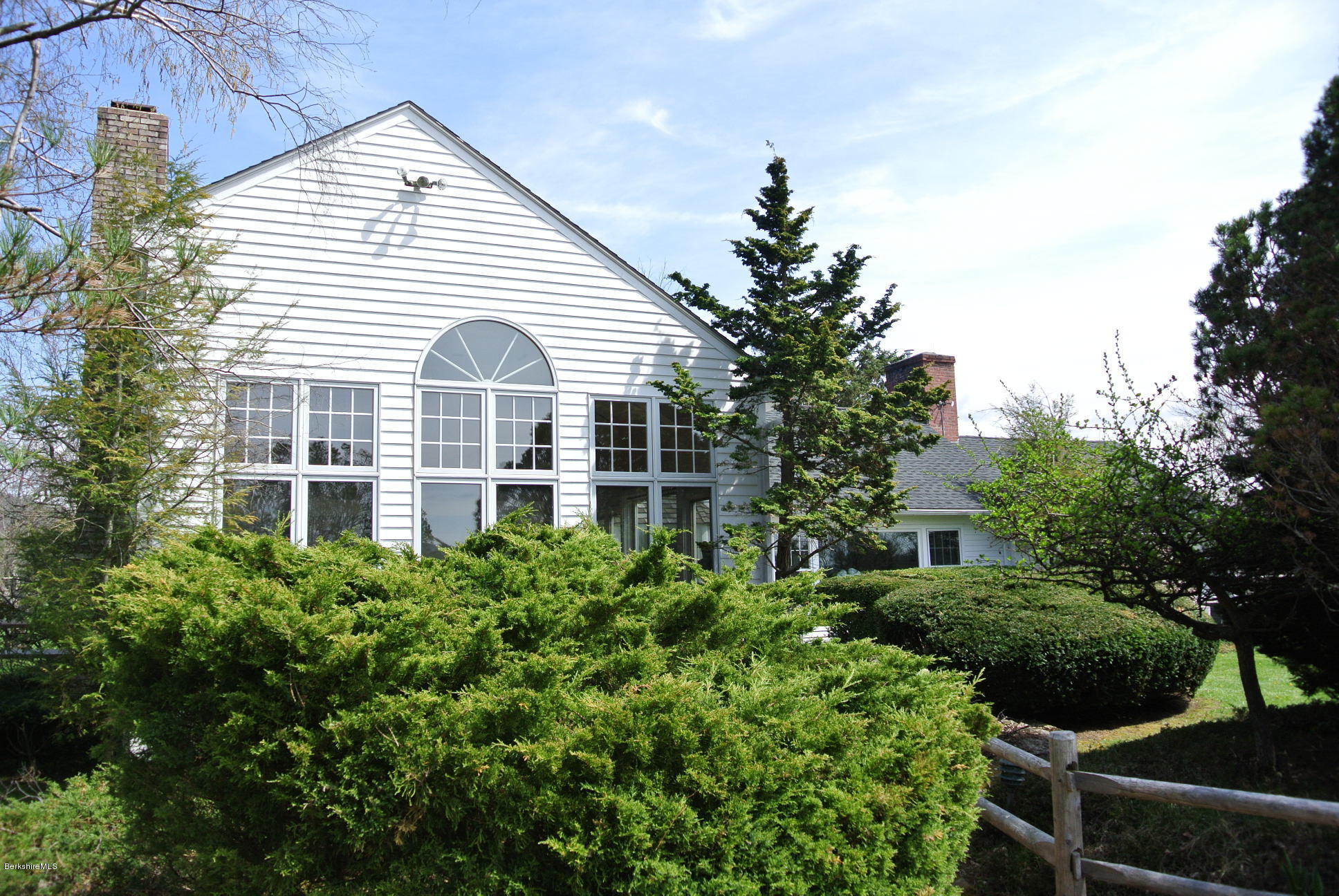 25 Prospect Hill Road Stockbridge, MA 01262 - Photo 24 of 30 a view of a white house next to a yard