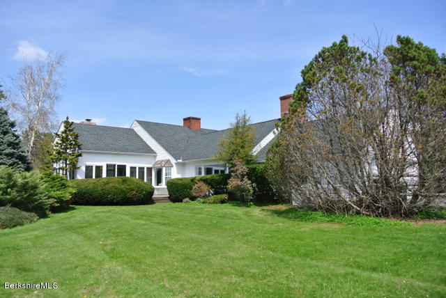 25 Prospect Hill Road Stockbridge, MA 01262 - Photo 25 of 30 a view of house in front of a big yard with plants and large trees