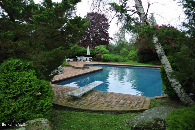 25 Prospect Hill Road Stockbridge, MA 01262 - Photo 27 of 30 a view of a wooden house with a yard and sitting area