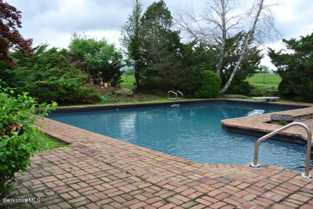 25 Prospect Hill Road Stockbridge, MA 01262 - Photo 28 of 30 a lake view with a wooden fence and bench