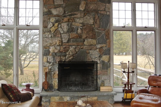 25 Prospect Hill Road Stockbridge, MA 01262 - Photo 8 of 30 a living room with furniture and a fireplace
