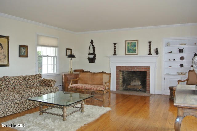 25 Prospect Hill Road Stockbridge, MA 01262 - Photo 10 of 30 a living room with furniture and a fireplace